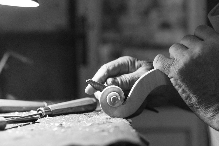 Cropped hand of man working at workshop