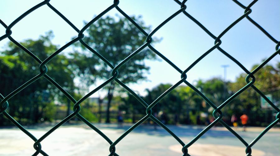 Full frame shot of chainlink fence against sky