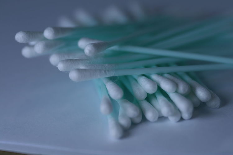 Close-up of cotton swabs on table