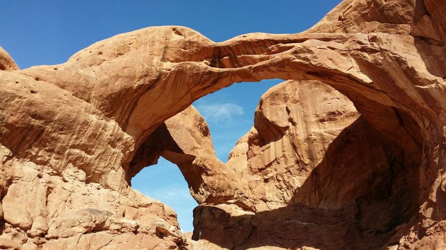 Low angle view of natural arch