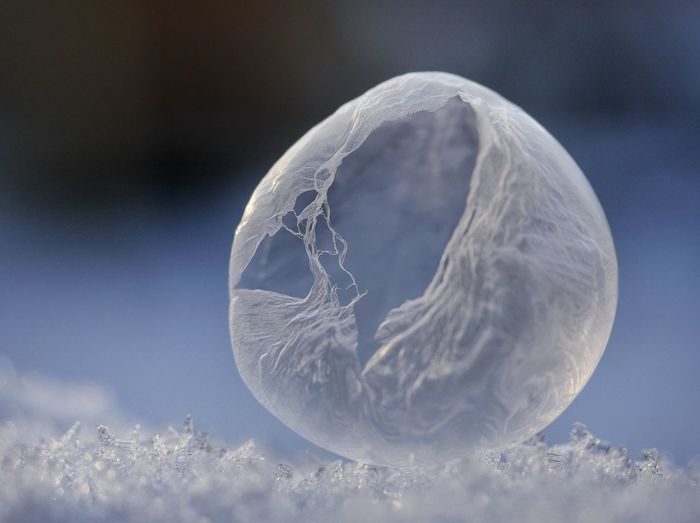 Macro shot of soap bubble on ice