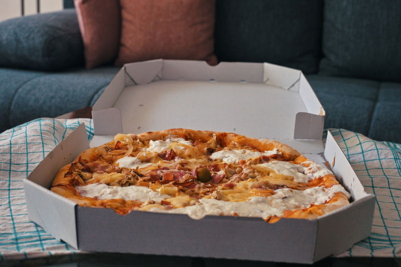 Closeup of delicious takeout pizza on a table