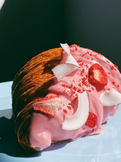 Croissant with the strawberry and coconut slices