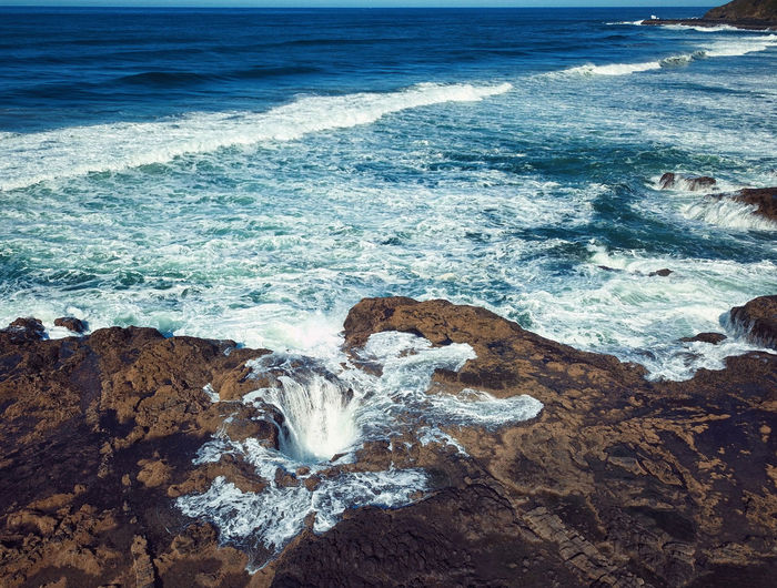 High angle view of sea waves at thors well