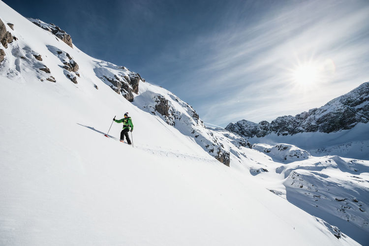 Man ski touring in alpine winter wonderland, arlberg, austria