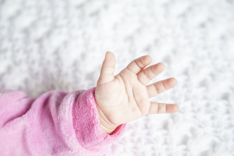 Cropped hand of baby