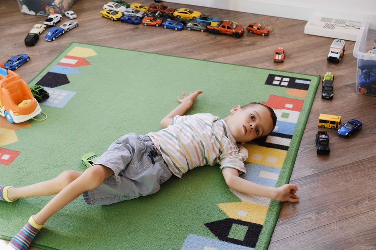 High angle view of boy playing with toys