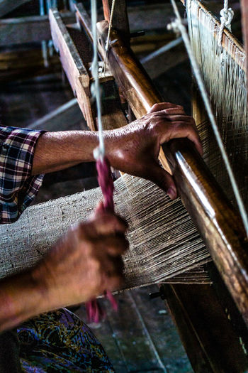 Close-up side view of old fashioned fabric loom