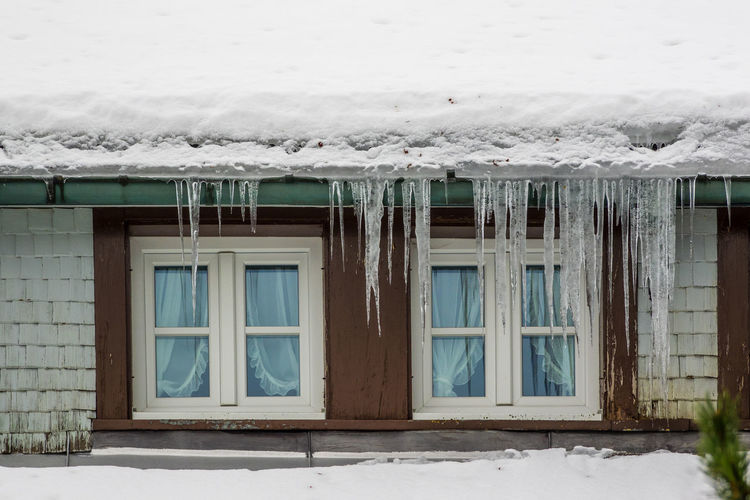 Snow covered house window