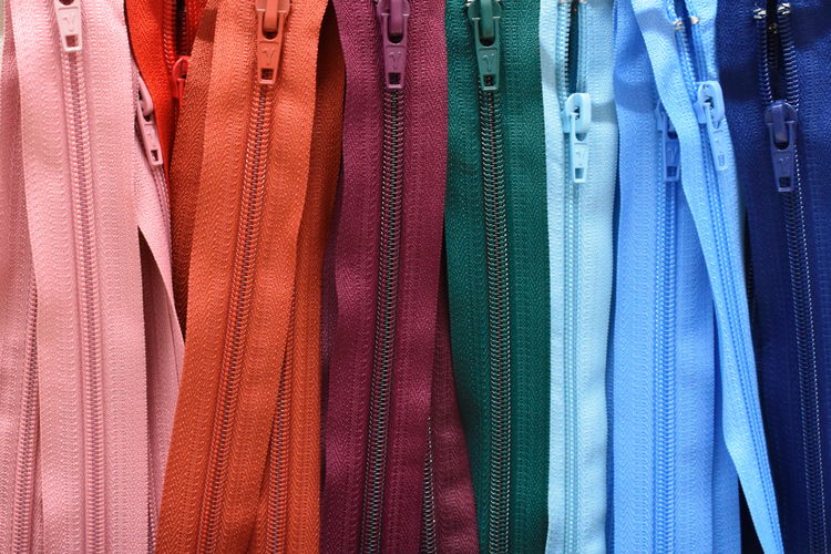 Full frame shot of multi colored zippers