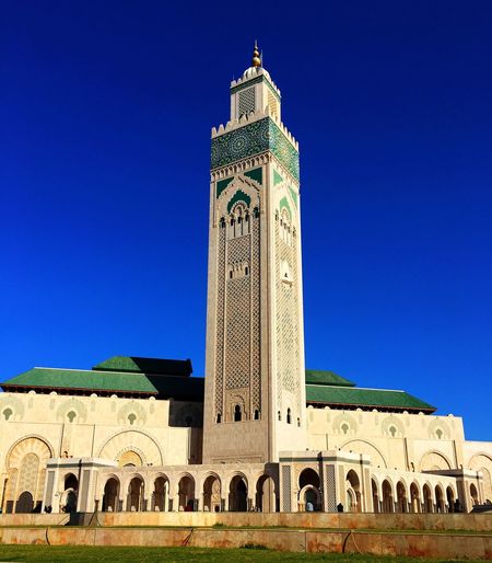 Hassan ii mosque against clear blue sky