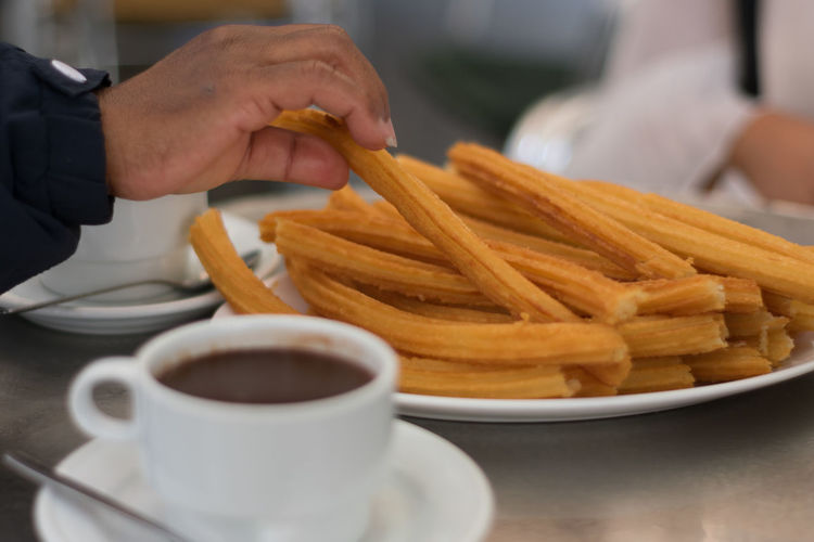 Hot cup of chocolate with artisenal churros