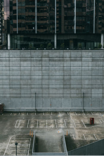 High angle view of parking lot and building in city