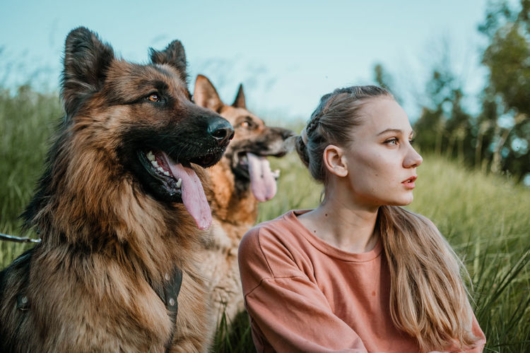 Portrait of young woman with dog