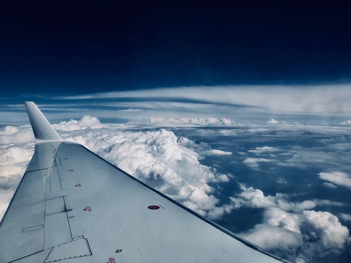 Cropped image of aircraft wing against sky