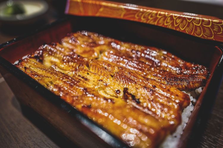 Close-up of unagi eel in container on table