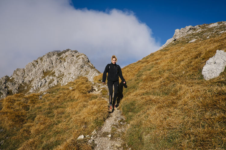 Full length of woman walking on trail