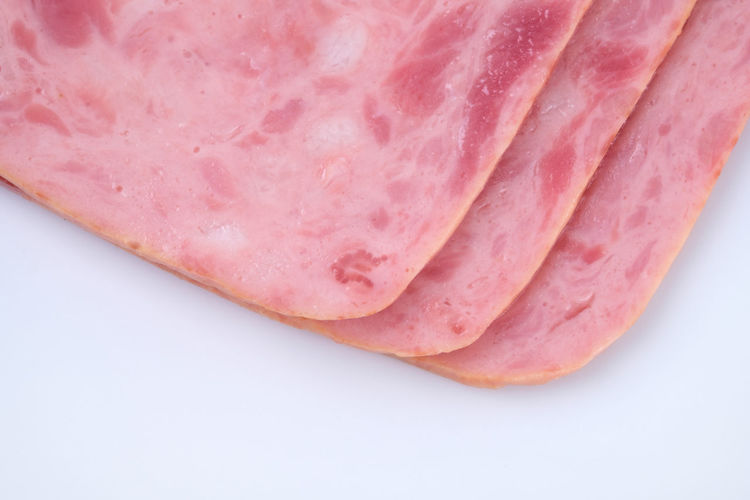 High angle view of pink slices in plate