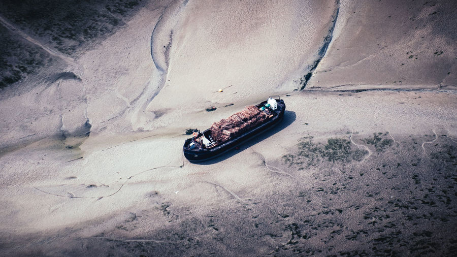 High angle view of boat moored on beach