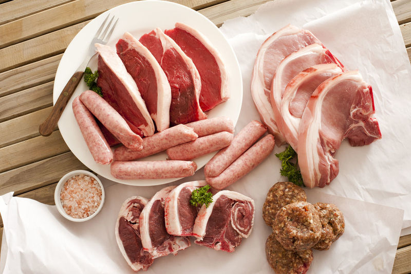 High angle view of various meats on table