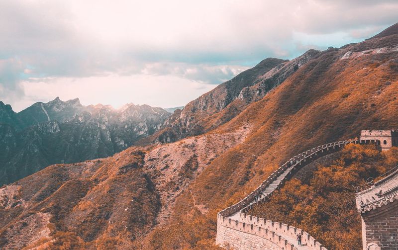 Panoramic view of mountains against cloudy sky