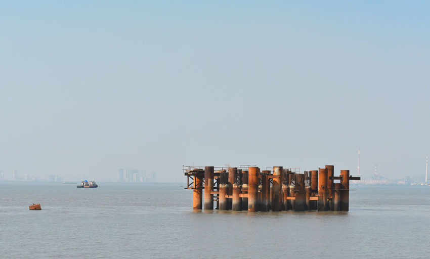 Panoramic view of pier on sea against clear sky