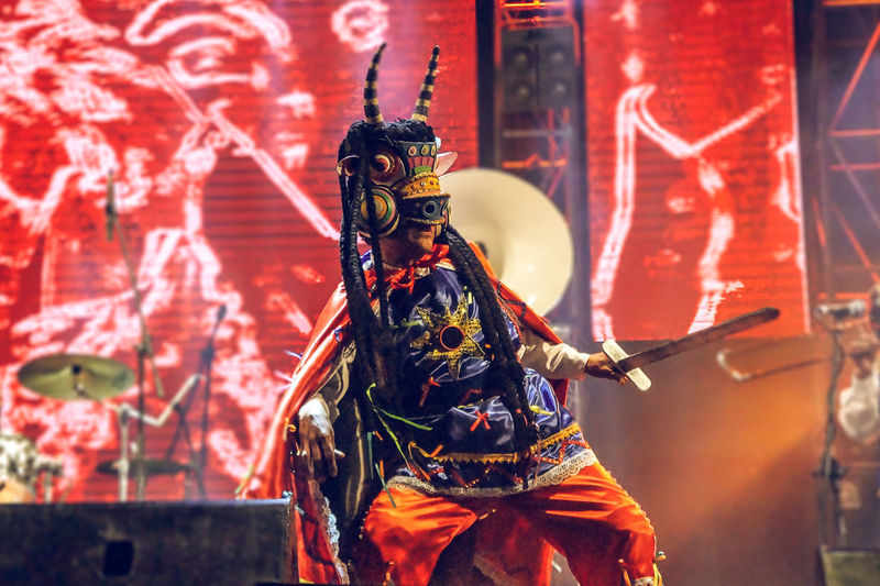 Man wearing costume performing on stage