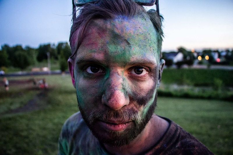 Close-up portrait of man covered with powder paint