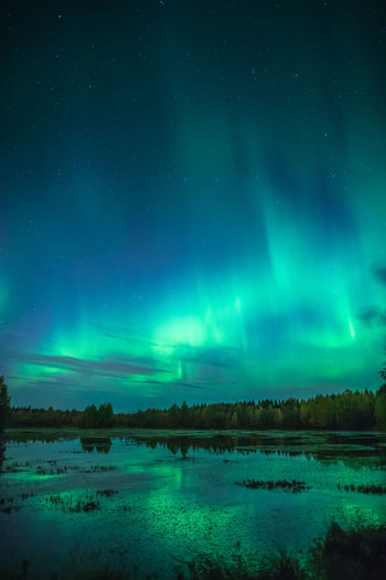 Scenic view of sea against sky at night
