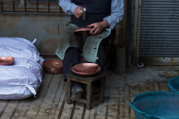 Midsection of man sitting