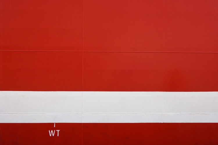 Red ship hull with weight load line