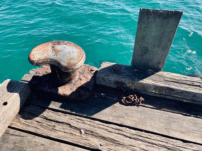 High angle view of rusty pier over sea