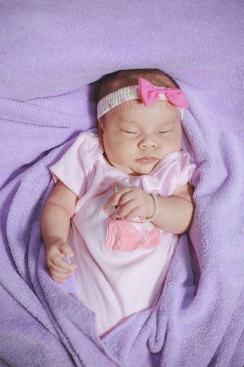 High angle view of cute baby sleeping