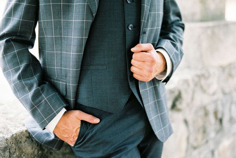 Midsection of businessman holding hands