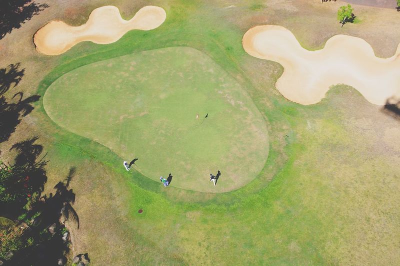 High angle view of people playing at golf course