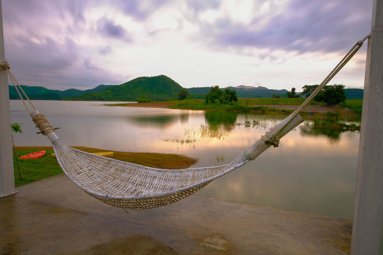 Hammock at lake against sky in the morning kaeng krachan