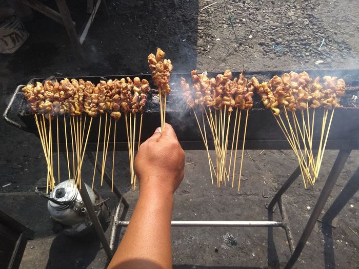 Midsection of person preparing food