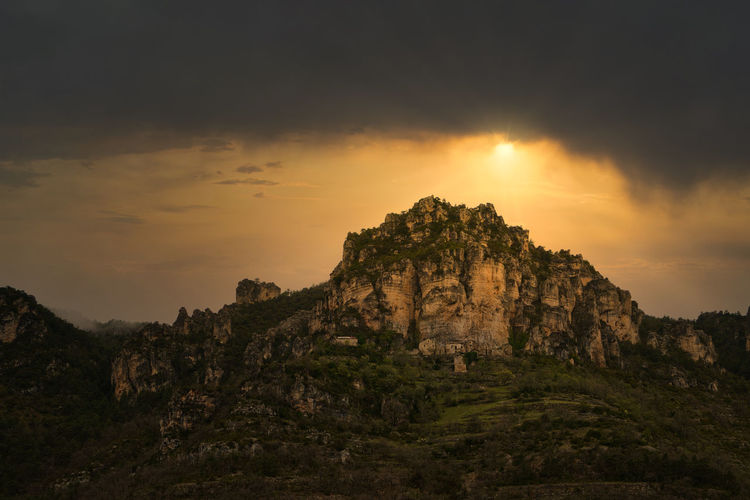Rock formation on mountain against sky during sunset. france