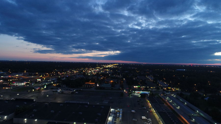 High angle view of illuminated city buildings at night