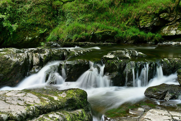 Long exposure of the river lyn flowing over rocks in lynmouth in devon 