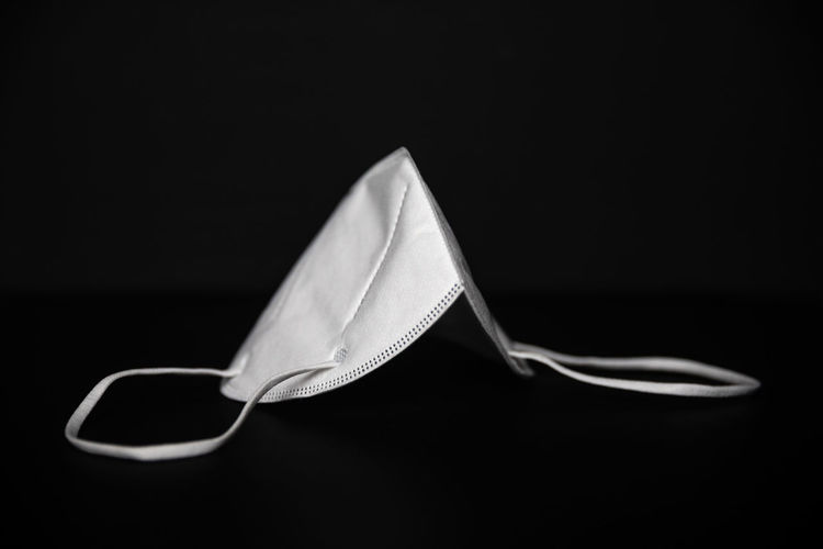 Close-up of fork on table against black background
