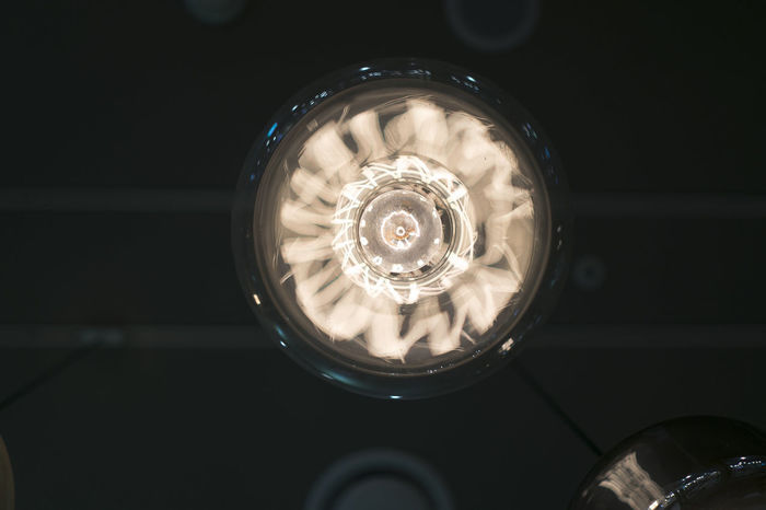 Close-up of electric light hanging from ceiling