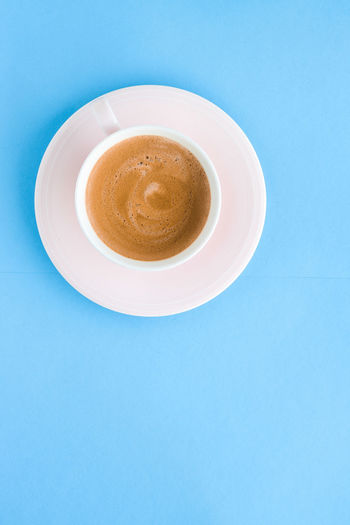 Directly above shot of coffee on blue background
