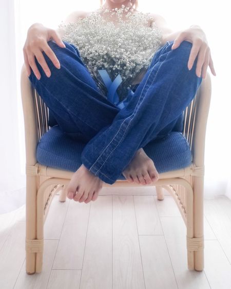 Low section of woman sitting on floor