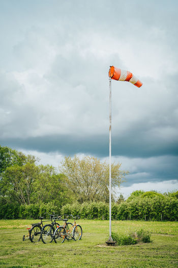 Bicycle on field against sky