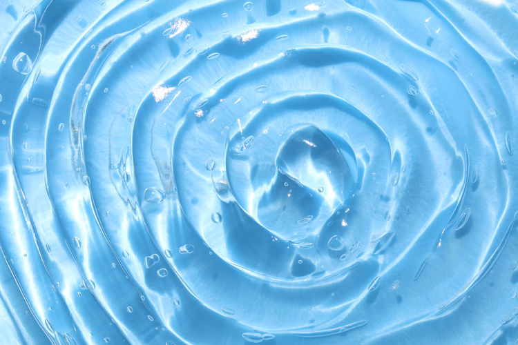 Blue water wave abstract or pure natural bubble texture, gel soap, background photography