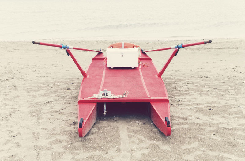 Red boat on beach