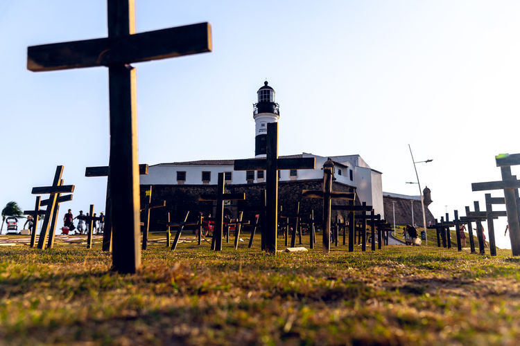 Crosses fixed to the ground in honor of those killed by covid-19 at farol da barra in brazil.