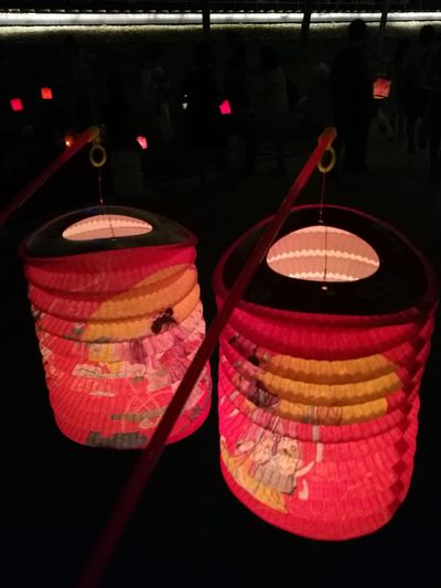 Close-up of lantern hanging in the dark