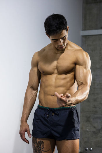Close-up of shirtless muscular man